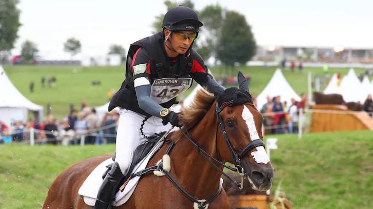Alex Hua Tian s'est imposé aujourd'hui dans le CIC 3* de Bramham aux commandes de Don Genito. Ici, le Chinois aux Jeux équestres mondiaux 2014 associé à Harbour Pilot C.