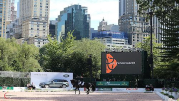 Judy Reynolds riding againstthe New York skyline