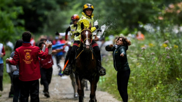 Germany's Sabrina Arnold and Tarzibus on their way individual gold
