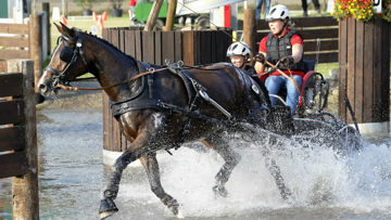 Germany's Anika Geiger through the water obstacle