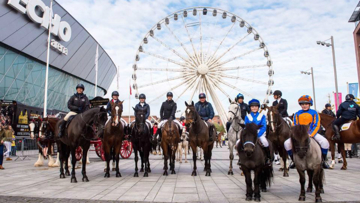 Founder Nina Barbour, left, accompanied by famous riders finish outside the Echo Arena