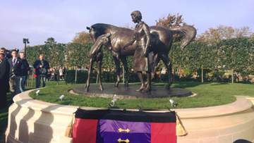 The new statue, unveiled by the Queen today, draped with Her Majesty's racing colours