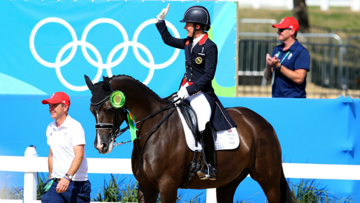 Alan Davies accompanies Charlotte Dujardin and Valegro into the arena at Rio