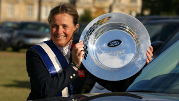 Pippa Funnell lifts the Burghley Trophy for the second time