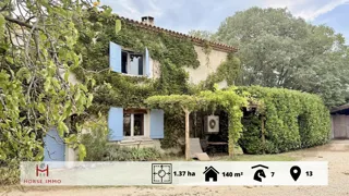 Propriété équestre avec villa, logements locatifs, écurie de 7 boxes et manège couvert 20x40, alliant habitat, revenus locatifs et installations équestres complètes.