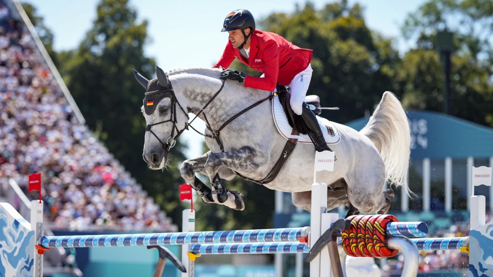Christian Kukuk et Checker 47 pendant la finale individuelle des Jeux olympique de Paris, le 6 août 2024, à Versailles.