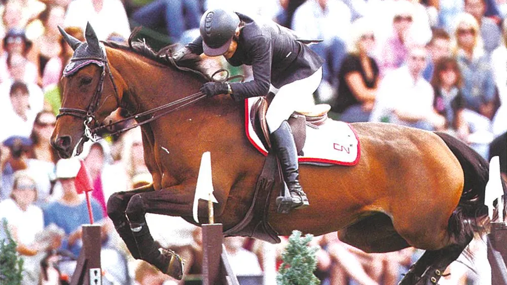 En 2006, Eugénie Angot a écrit l’une des plus belles pages de sa carrière en remportant le mythique Grand Prix de Calgary aux rênes de sa fidèle Cigale du Taillis. © Dirk Caremans/HippoFoto